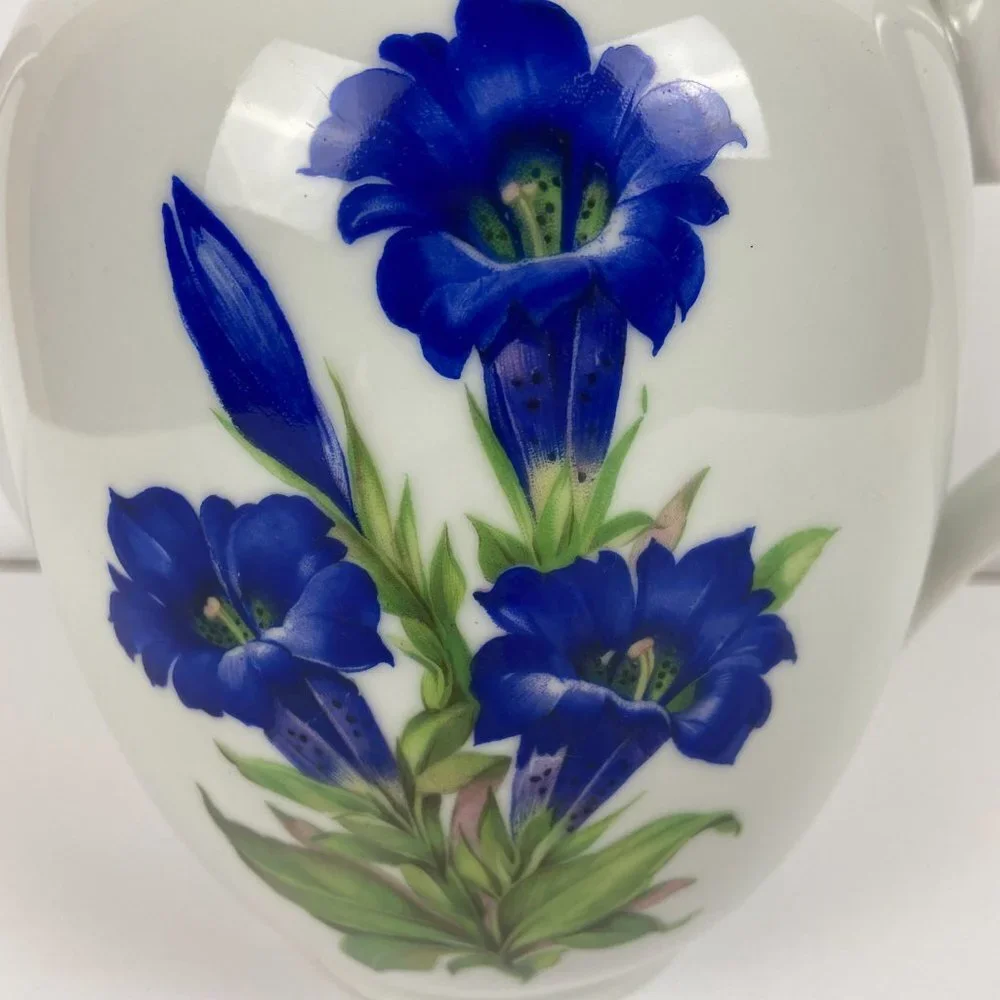 Vintage porcelain large tea pot with the floral decor